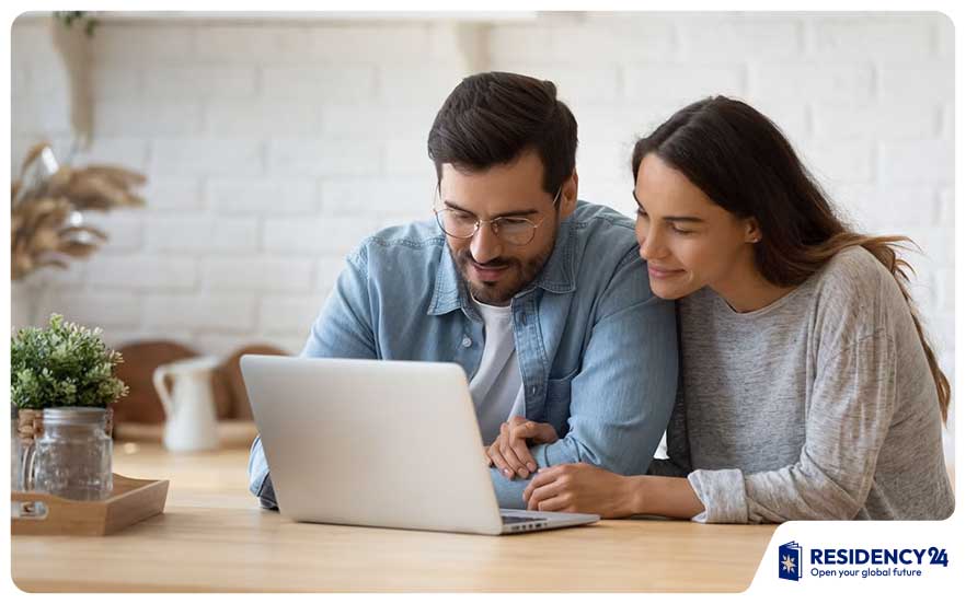 Couple-calculating-mortgage-payments-with-laptop-and-documents.jpg